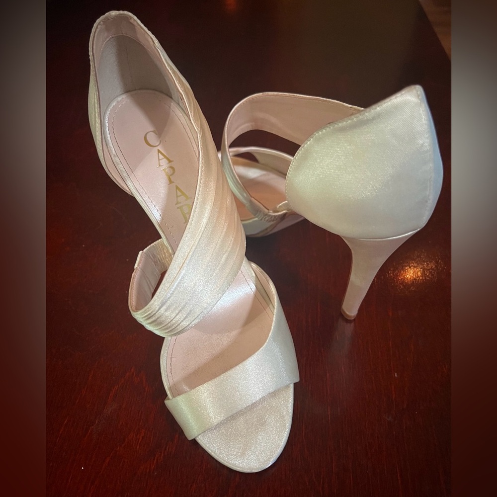 Whiteish silver high heeled shoes